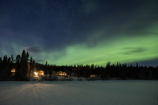 Northern lights in Whitehorse Yukon Territories Southern Lakes Lodge at night in winter