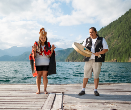 Couple standing on the dock of a mountain lake