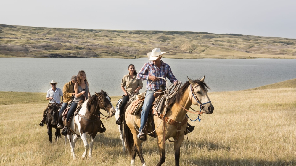 People riding horses in Saskatchewan