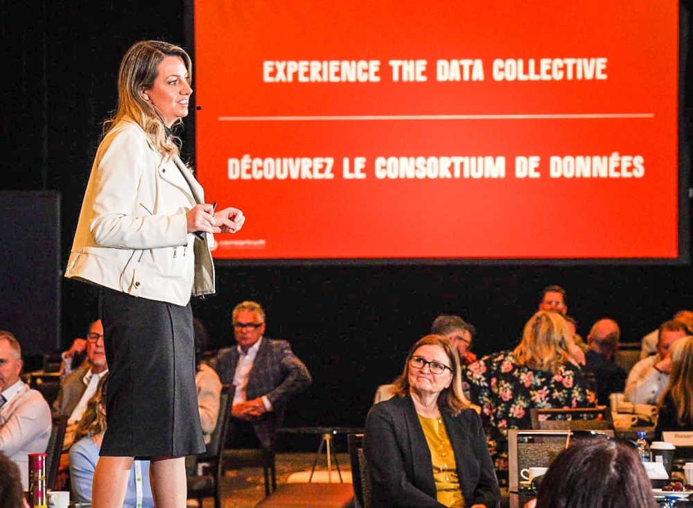 Meaghan Ferrigno presents on stage about the Data Collective