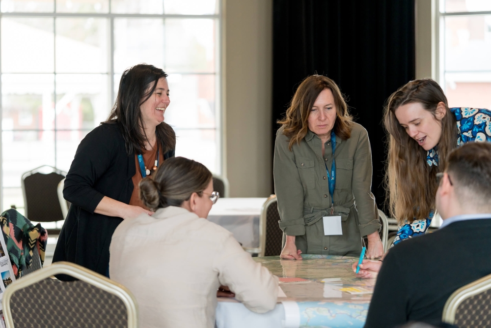 people around a table collaborating